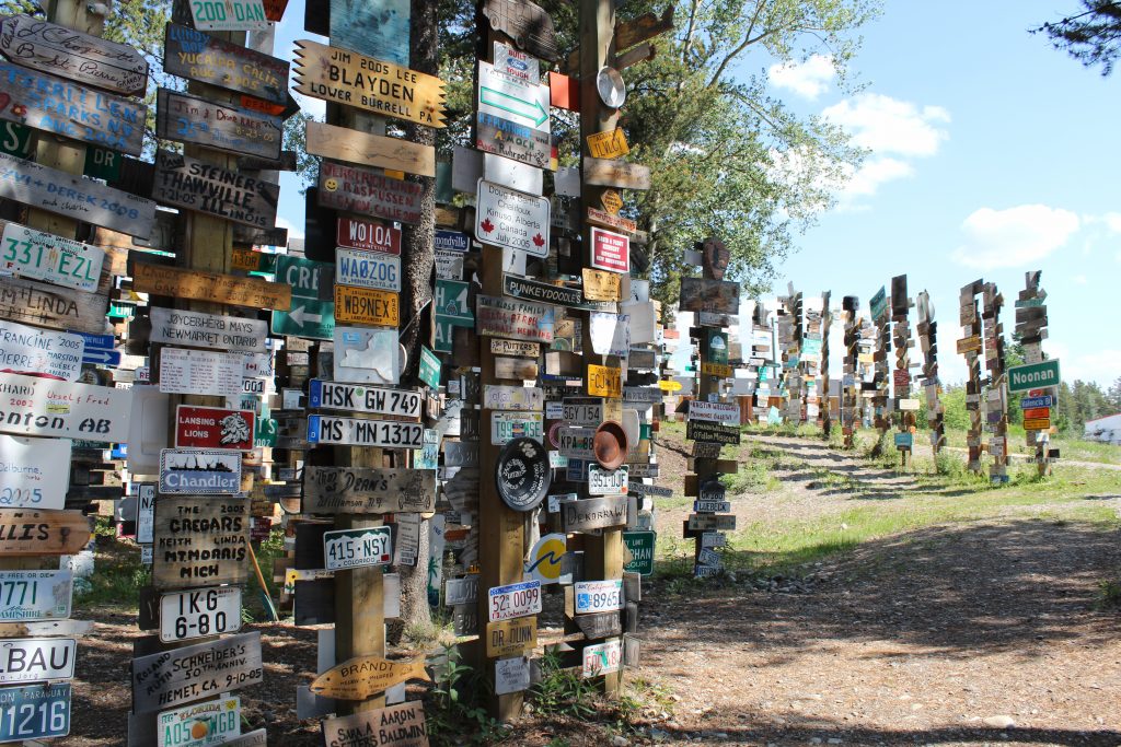 Watson Lake Signpost forest, which is poles with signs from all around the world affixed to them
