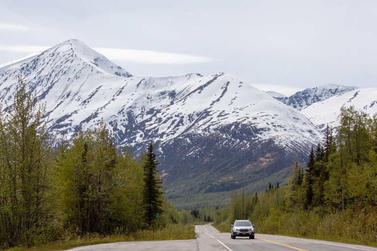 Photo of the Day: Richardson Highway Views Car drives with snowy mountains behind