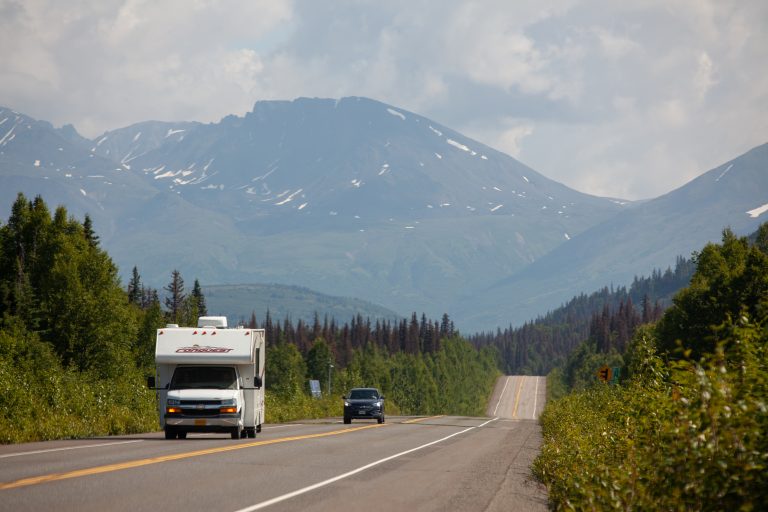 Motorhome and car on highway
