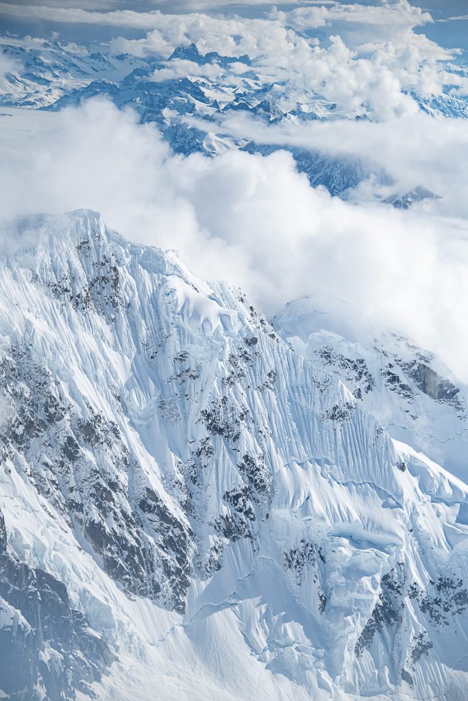 Snow-covered mountains in the Alaska range from an aerial perspective