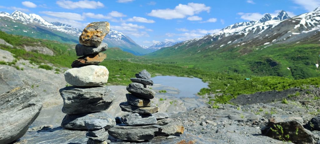 Rock Cairns at the head of a green valley
