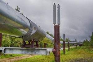 a photo of the pipeline winding through green area