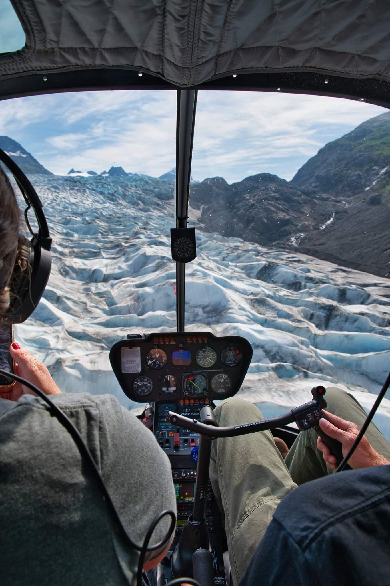 glacier viewable from inside cockpit of helicopter